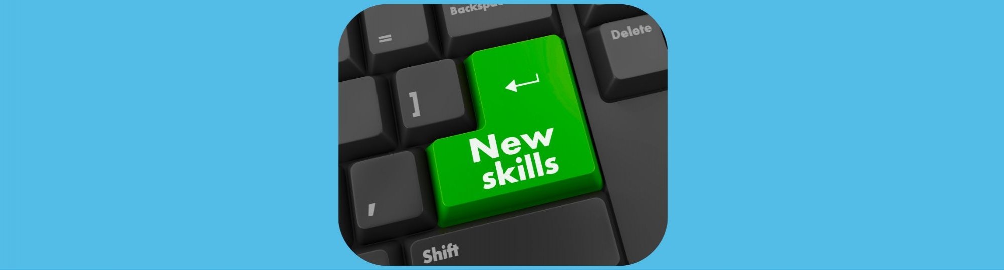 photo on blue background is close up of green keyboard button called new skills.
