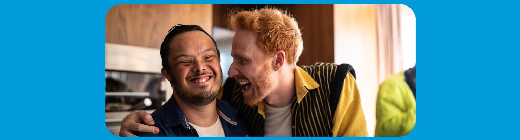 Banner: Two men laughing together, one has his arm around the other man's shoulder.